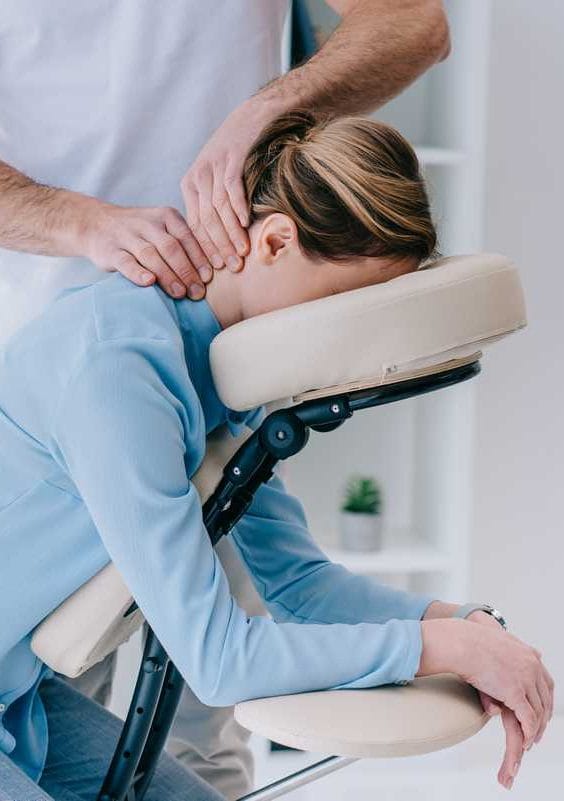 office worker receiving a seated corporate massage from relax mobile massage in melbourne to relieve stress and improve workplace wellbeing