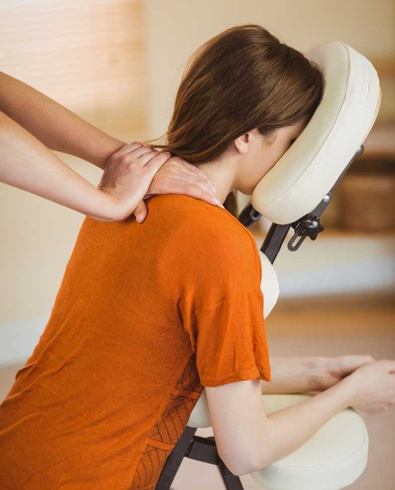 office worker receiving a seated corporate massage from relax mobile massage in melbourne to relieve stress and improve workplace wellbeing