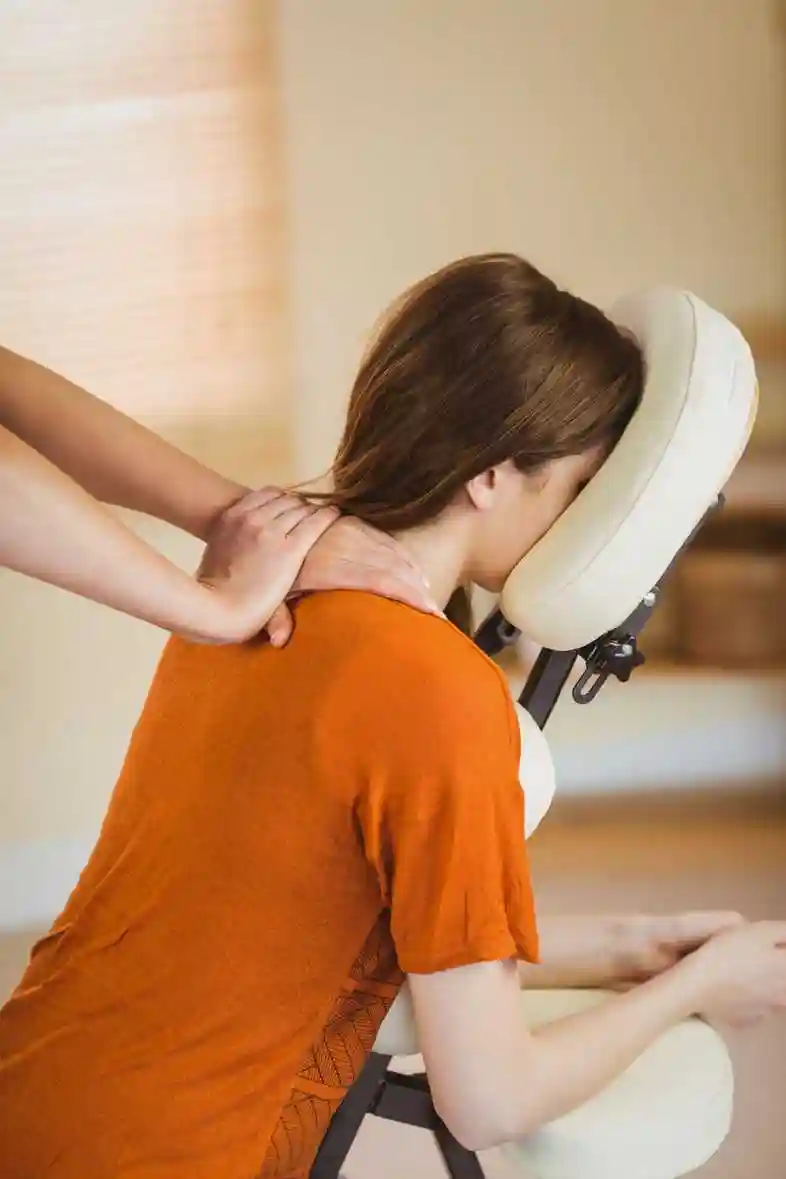 office worker receiving a seated corporate massage from relax mobile massage in melbourne to relieve stress and improve workplace wellbeing