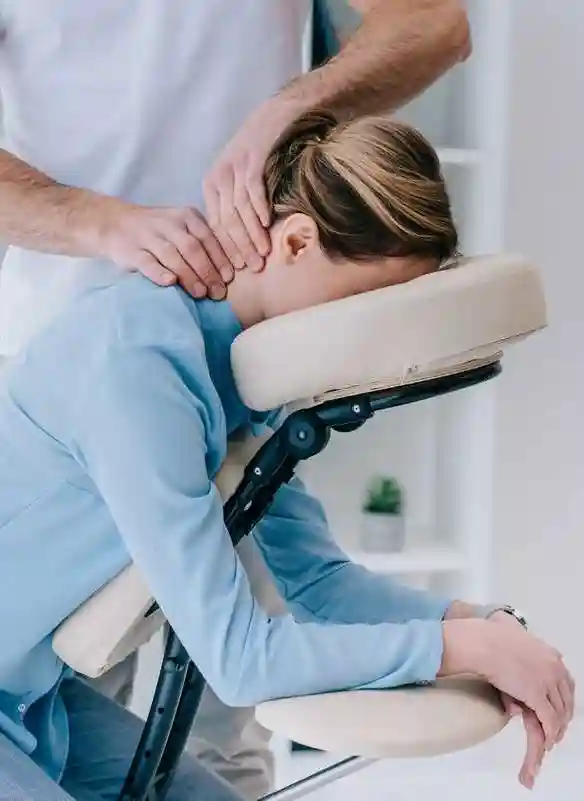 office worker receiving a seated corporate massage from relax mobile massage in melbourne to relieve stress and improve workplace wellbeing